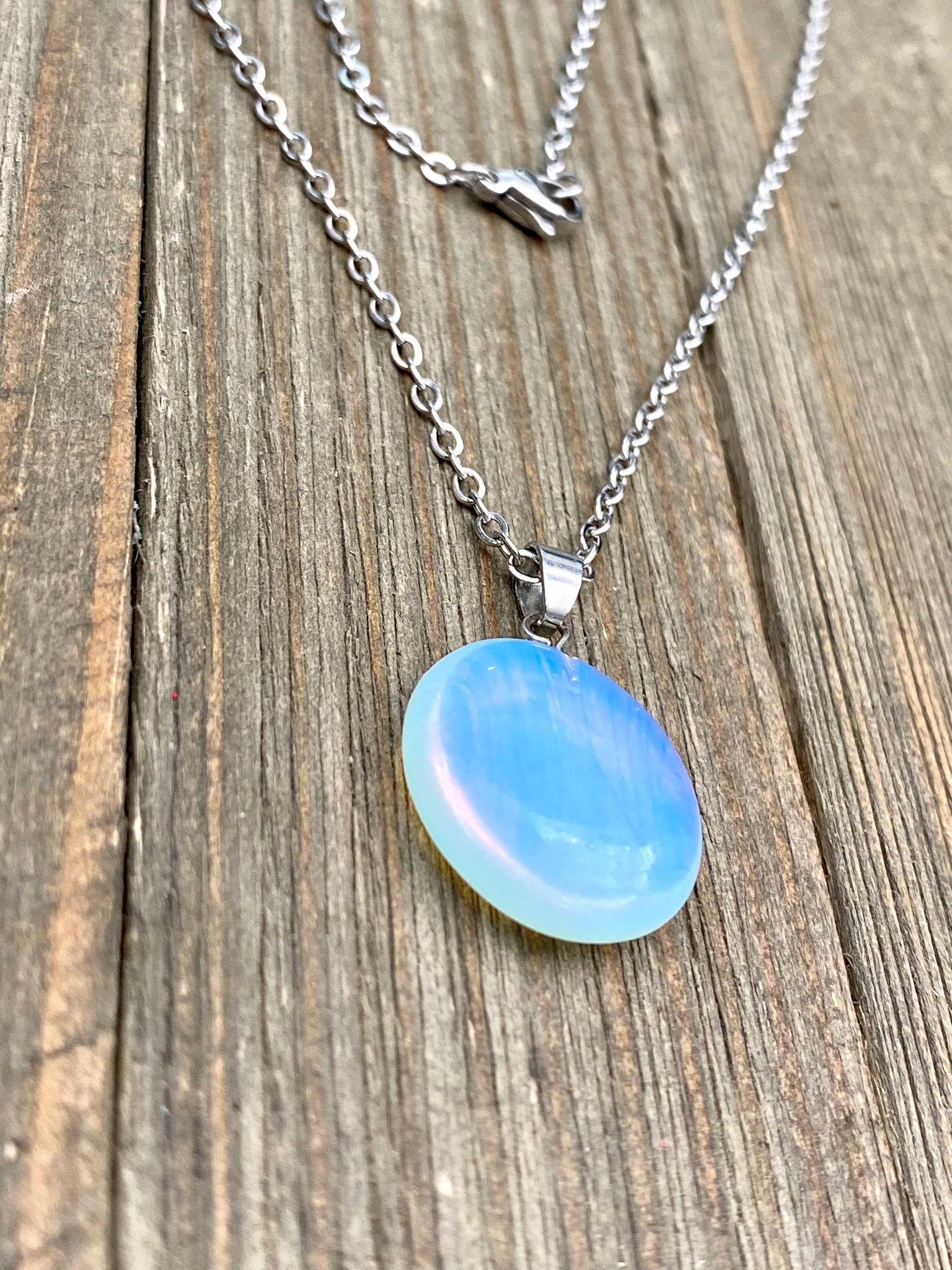 An Eye catching synthetic Opal stone round shape Pendant Necklace with High Quality No Fade Non Tarnish Hypoallergenic Stainless Steel chain