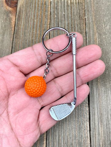 Golf club and ball set keychain. Silver Metal Golf club keychain. Orange Golf ball keychain. Golf players keychain. Golf coach keychain. Sports keychain.