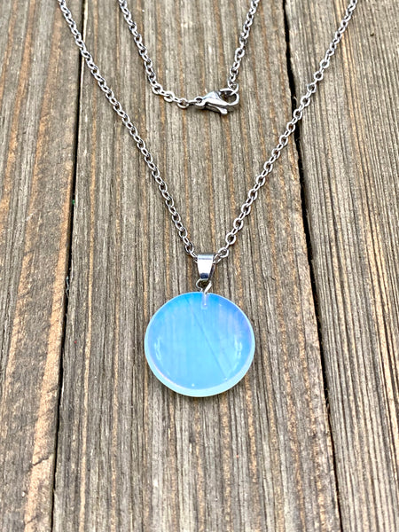 An Eye catching synthetic Opal stone round shape Pendant Necklace with High Quality No Fade Non Tarnish Hypoallergenic Stainless Steel chain