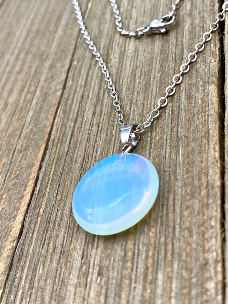 An Eye catching synthetic Opal stone round shape Pendant Necklace with High Quality No Fade Non Tarnish Hypoallergenic Stainless Steel chain